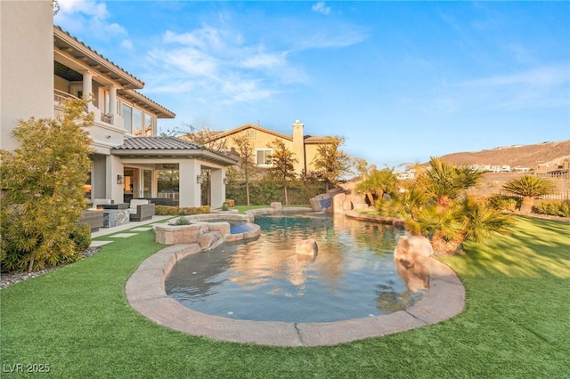 view of pool featuring a yard