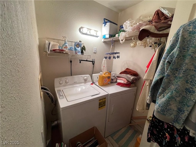 clothes washing area featuring washer and dryer