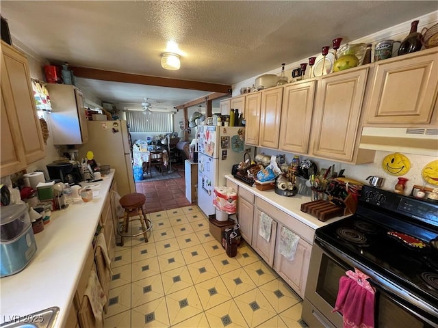 kitchen featuring light brown cabinetry, a textured ceiling, white fridge, range with electric cooktop, and ceiling fan