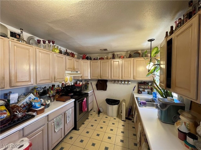 kitchen with electric range, a textured ceiling, and decorative light fixtures