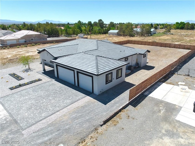 birds eye view of property with a mountain view