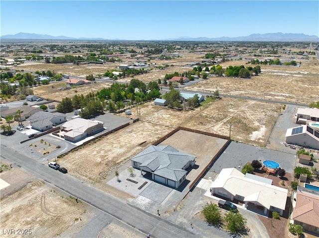 drone / aerial view featuring a mountain view