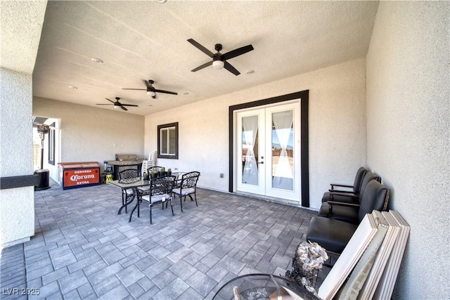 view of patio featuring french doors and ceiling fan