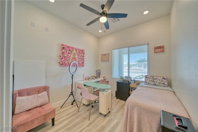 bedroom with ceiling fan and light wood-type flooring