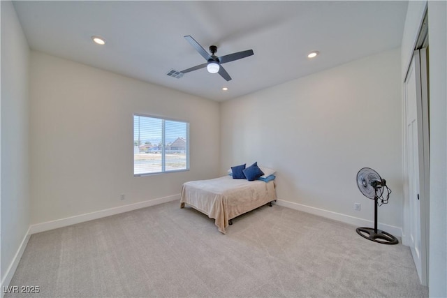 bedroom featuring light carpet and ceiling fan