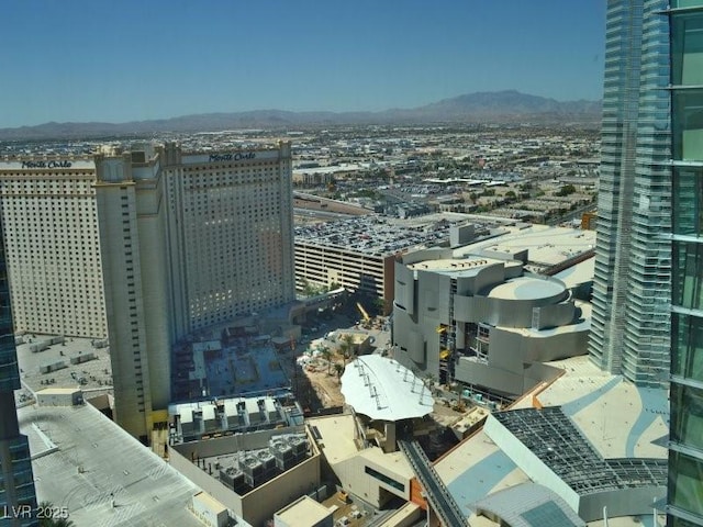 property's view of city with a mountain view