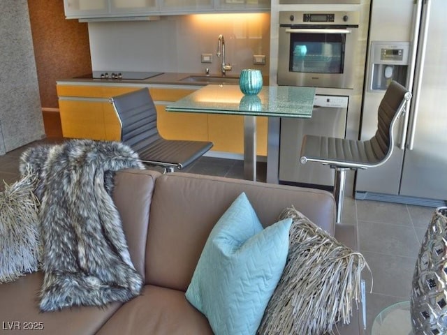 kitchen featuring sink, tile patterned floors, and stainless steel appliances