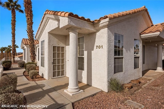 entrance to property with a patio area