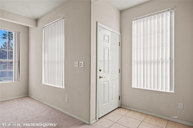 foyer with light tile patterned floors