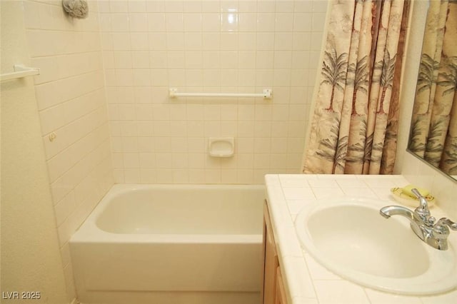 bathroom featuring vanity and independent shower and bath