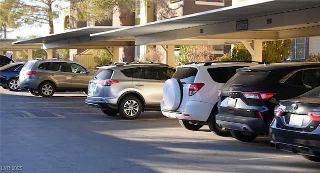 view of parking / parking lot with a carport