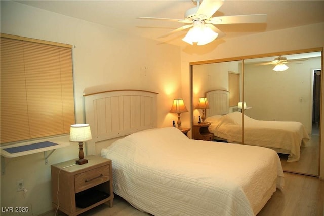 bedroom with wood finished floors, a closet, and ceiling fan