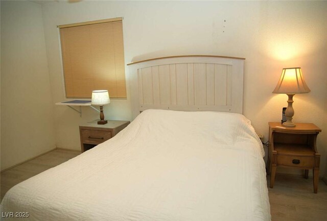 bedroom featuring wood finished floors