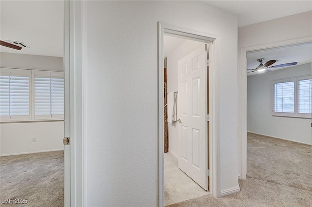 corridor with light colored carpet