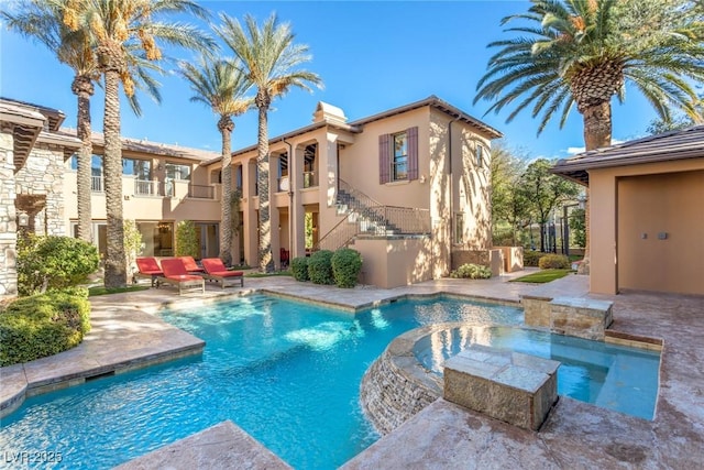 view of pool featuring an in ground hot tub and a patio area