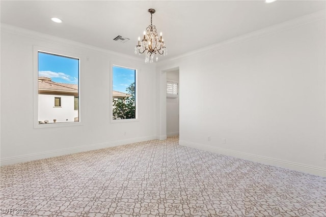 carpeted spare room featuring a notable chandelier and ornamental molding