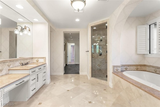 bathroom with tasteful backsplash, vanity, and plus walk in shower