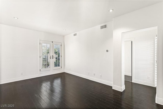 unfurnished room with french doors and dark hardwood / wood-style floors