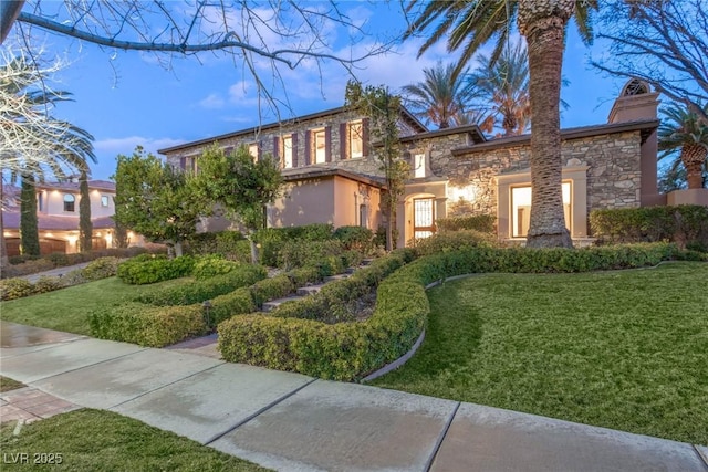 view of front of house with a lawn