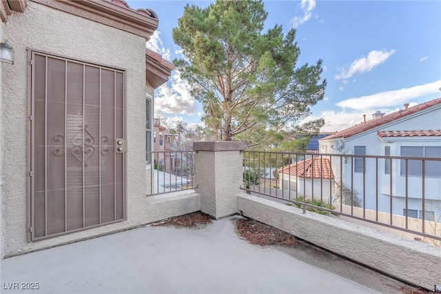 view of patio featuring a balcony