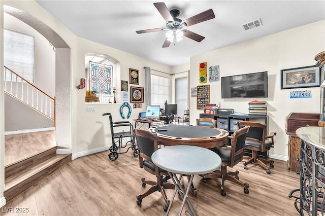 home office featuring ceiling fan and light hardwood / wood-style floors