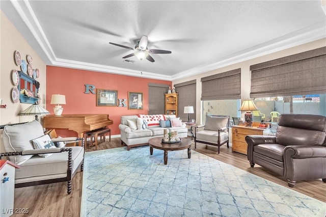 living room with ceiling fan and hardwood / wood-style floors