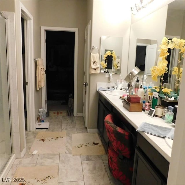 bathroom featuring a stall shower and vanity