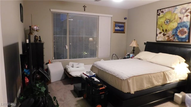 bedroom featuring light colored carpet