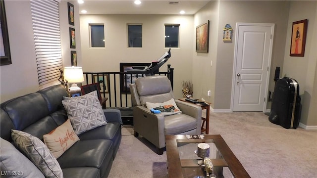 living area with recessed lighting, light carpet, and baseboards