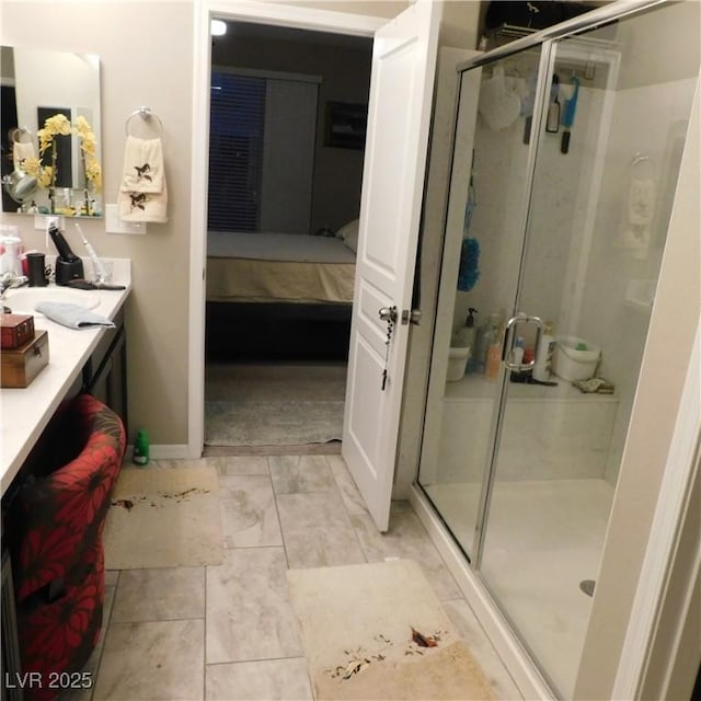 full bath with a stall shower, connected bathroom, and vanity