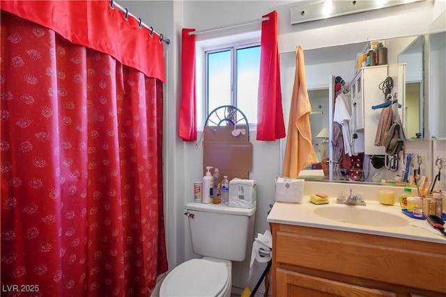 bathroom with vanity, a shower with curtain, and toilet