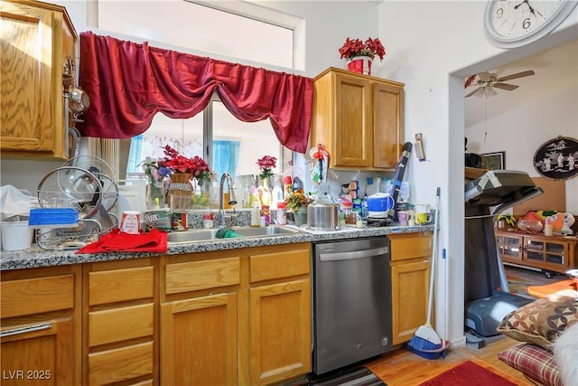 kitchen with stone counters, dishwasher, sink, ceiling fan, and light hardwood / wood-style floors