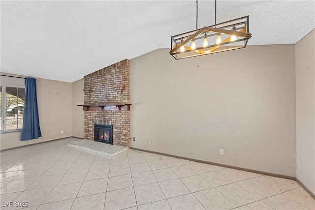 unfurnished living room featuring lofted ceiling, light tile patterned floors, a notable chandelier, a brick fireplace, and a textured ceiling