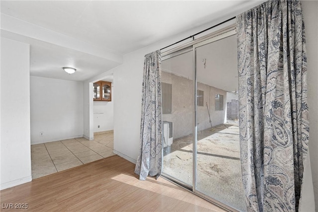 spare room featuring light wood-type flooring