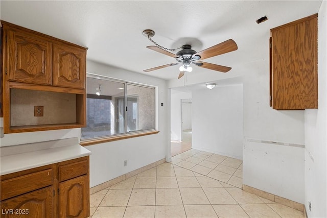 kitchen featuring ceiling fan and light tile patterned flooring