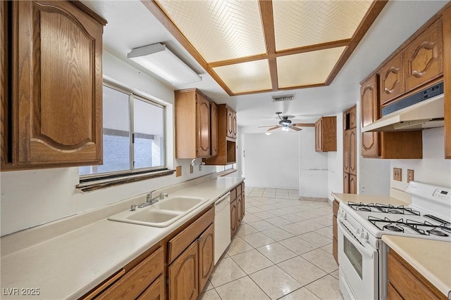 kitchen featuring ceiling fan, white appliances, sink, and light tile patterned floors