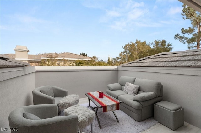 view of patio featuring a balcony