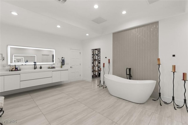 bathroom featuring vanity and a bathtub