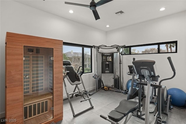 exercise room with ceiling fan