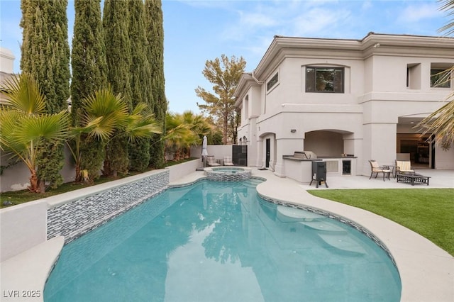 view of pool with a patio, area for grilling, and an in ground hot tub