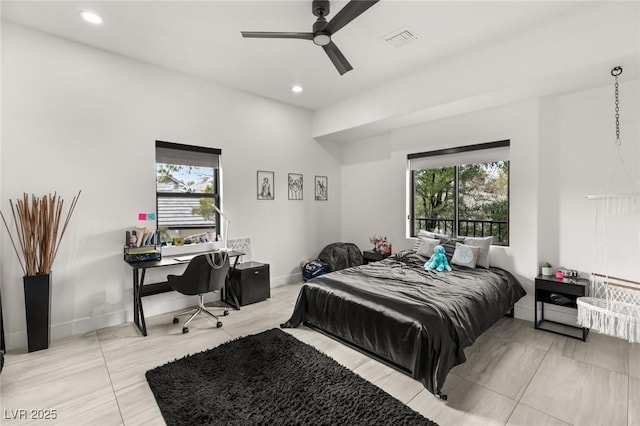 bedroom with multiple windows and ceiling fan