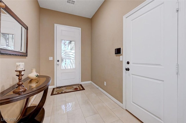 foyer entrance featuring light tile patterned floors