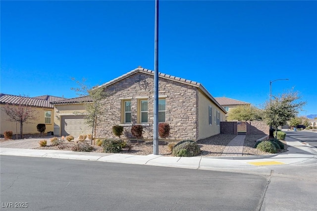 view of side of property with a garage