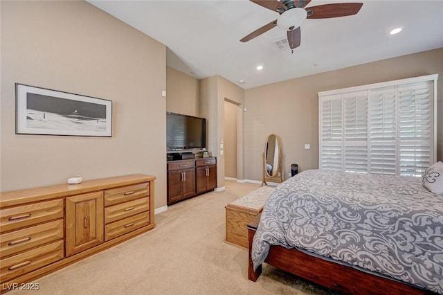 carpeted bedroom with ceiling fan