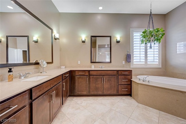 bathroom featuring vanity, a bath, and tile patterned floors