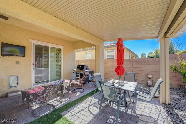 view of patio / terrace with an outdoor living space and area for grilling