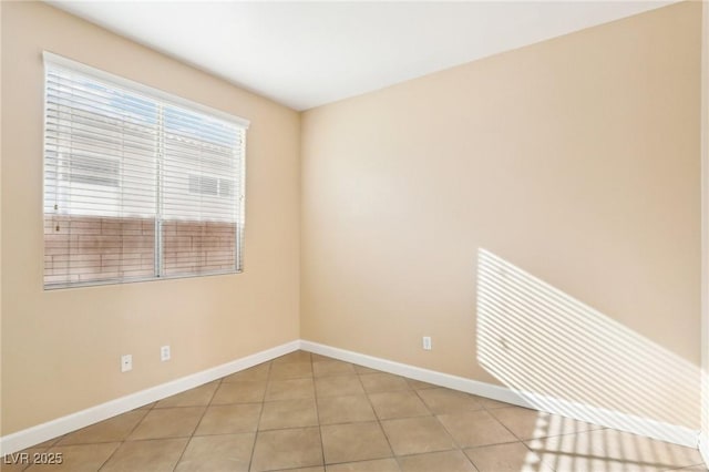 empty room with light tile patterned floors