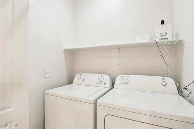 laundry room featuring washing machine and clothes dryer