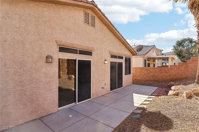 rear view of property with a patio area