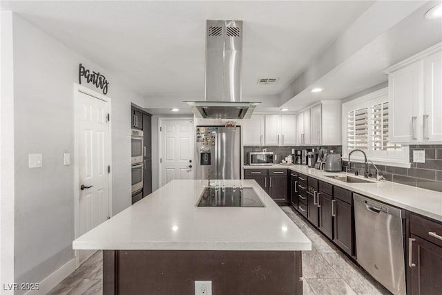 4410 E Boston Ave, Las Vegas, NV 89104 - kitchen featuring stainless steel appliances, a center island, sink, and island range hood